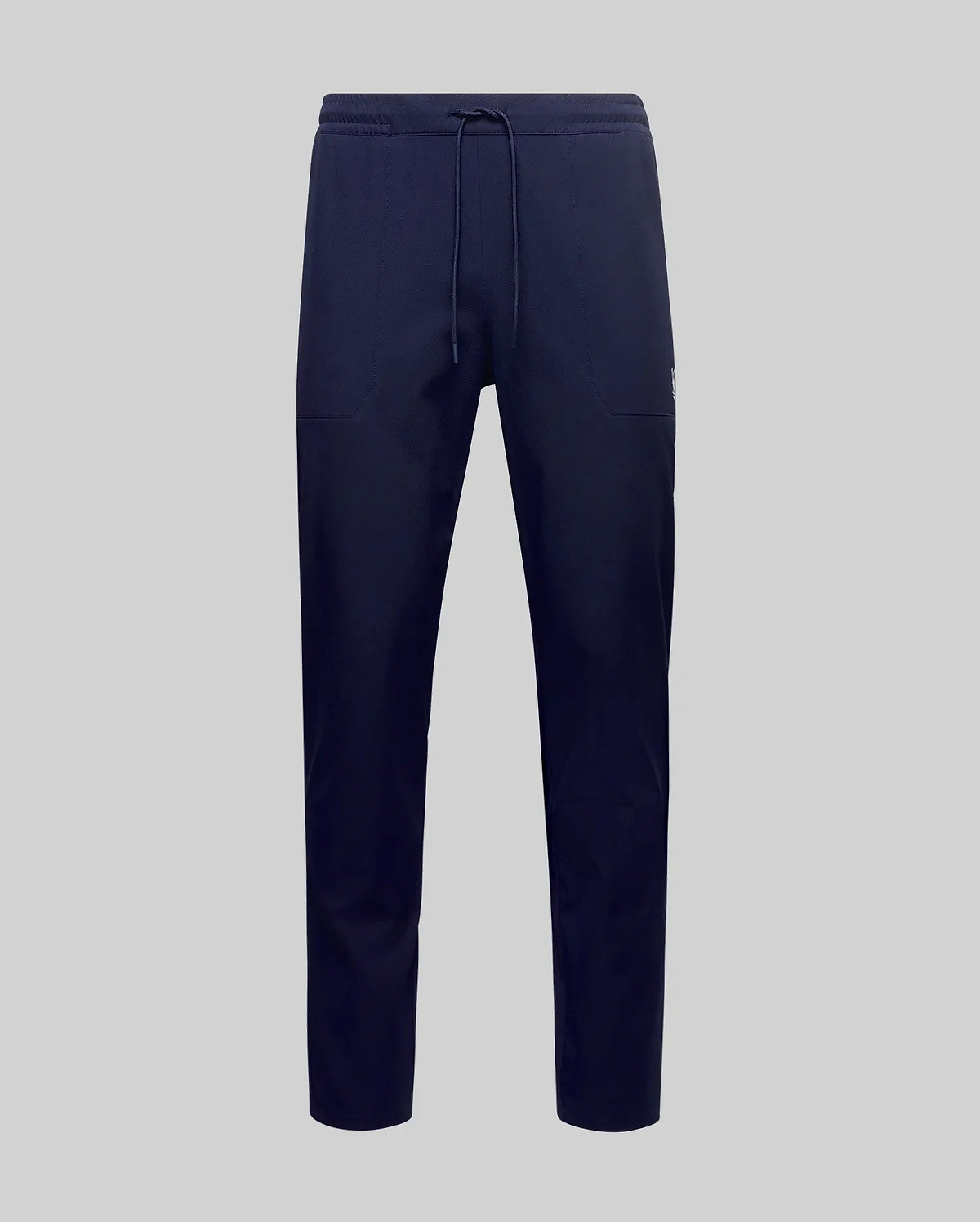 The Psycho Bunny MENS BEN TECH JOGGER PULL ON - MB0600013 features navy blue, soft polyester-spandex jogger pants with a drawstring waist, shown against a plain light gray background. (5)
