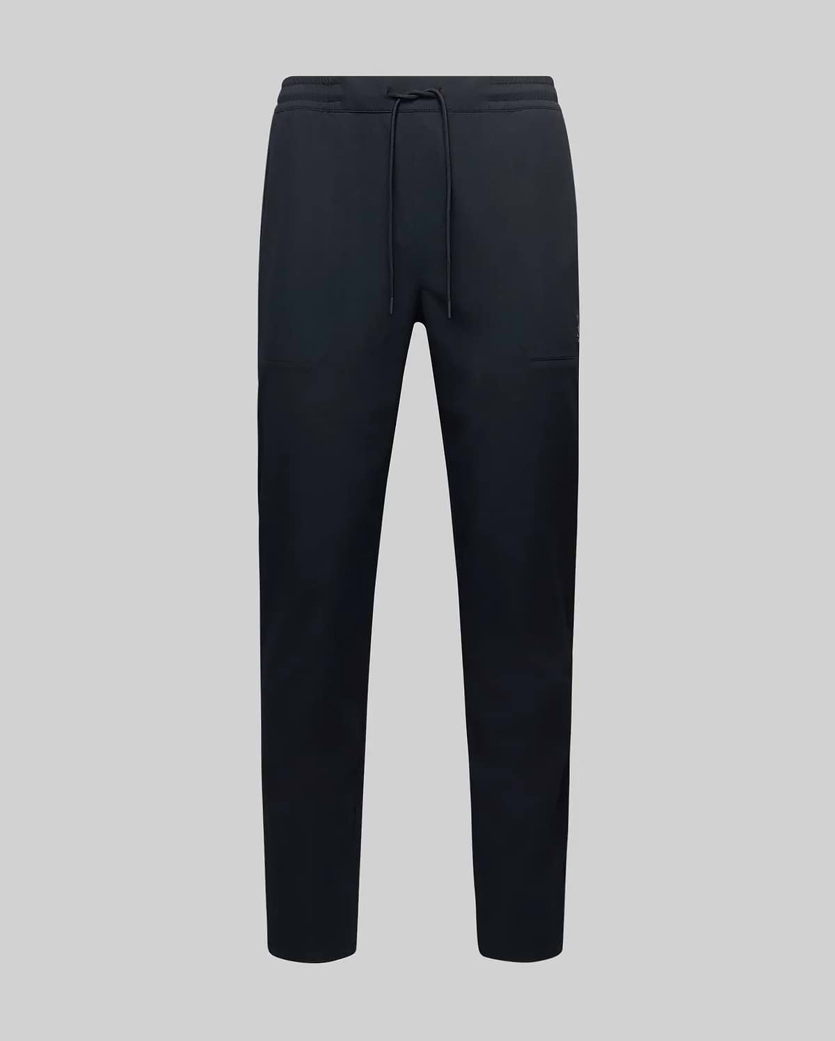 The MENS BEN TECH JOGGER PULL ON - MB0600013 by Psycho Bunny, made from polyester spandex fabric with an elastic waistband, drawstring, and side pockets, is shown against a plain light grey background.