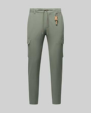 Mens Luka Cargo Pant in muted sage green, featuring a relaxed fit, smooth fabric, side cargo pockets, an orange drawstring waist, and a small orange Psycho Bunny skull keychain. (6)