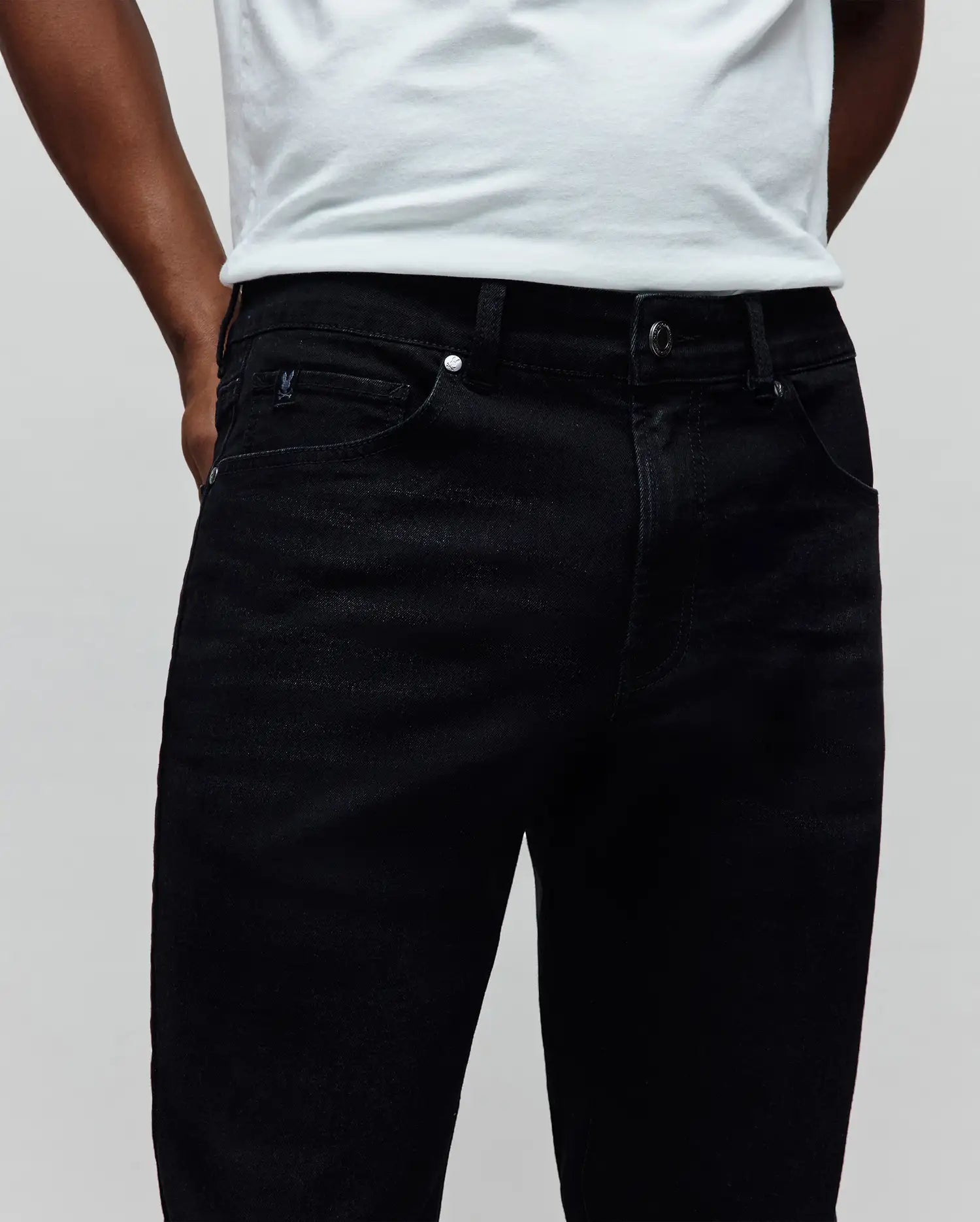 Mens Emerson Slim Fit Denim Pant in black denim, featuring a slim fit, small embroidered Psycho Bunny skull logo on the coin pocket, and silver branded hardware. (3)