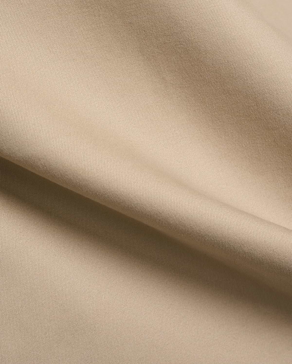 Mens Aidan Chino Pant in a warm khaki beige, featuring a refined, durable twill weave fabric with visible diagonal lines and a smooth, soft texture, draped in gentle folds.