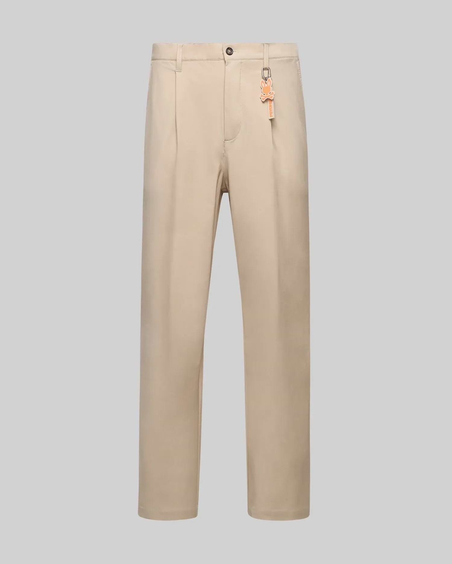 Beige Mens Malik Wide Leg Pant featuring a wide leg fit, subtle front pleats, smooth fabric, and an orange Psycho Bunny skull logo keychain attached to a belt loop. (5)