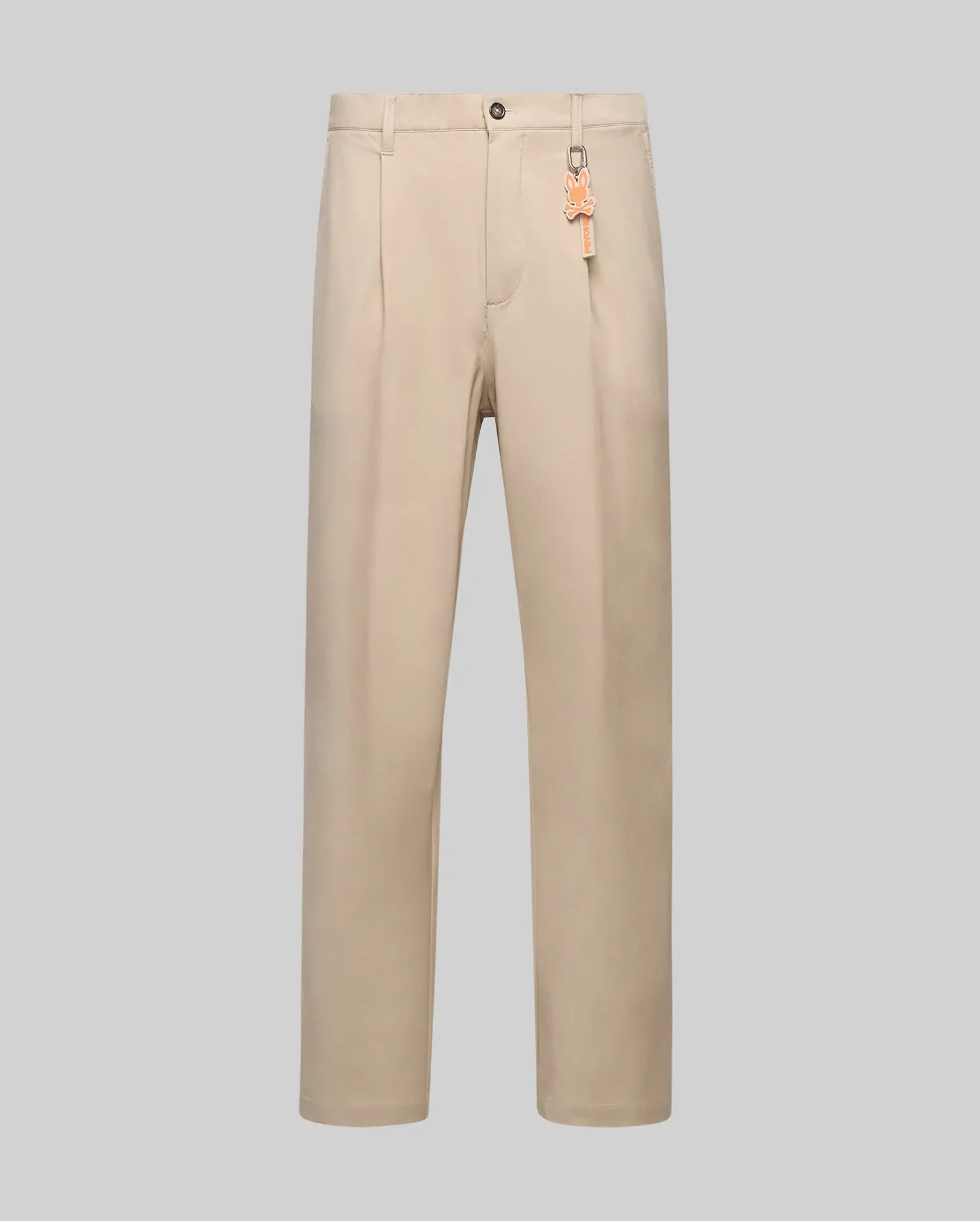 Beige Mens Malik Wide Leg Pant featuring a wide leg fit, subtle front pleats, smooth fabric, and an orange Psycho Bunny skull logo keychain attached to a belt loop. (5)