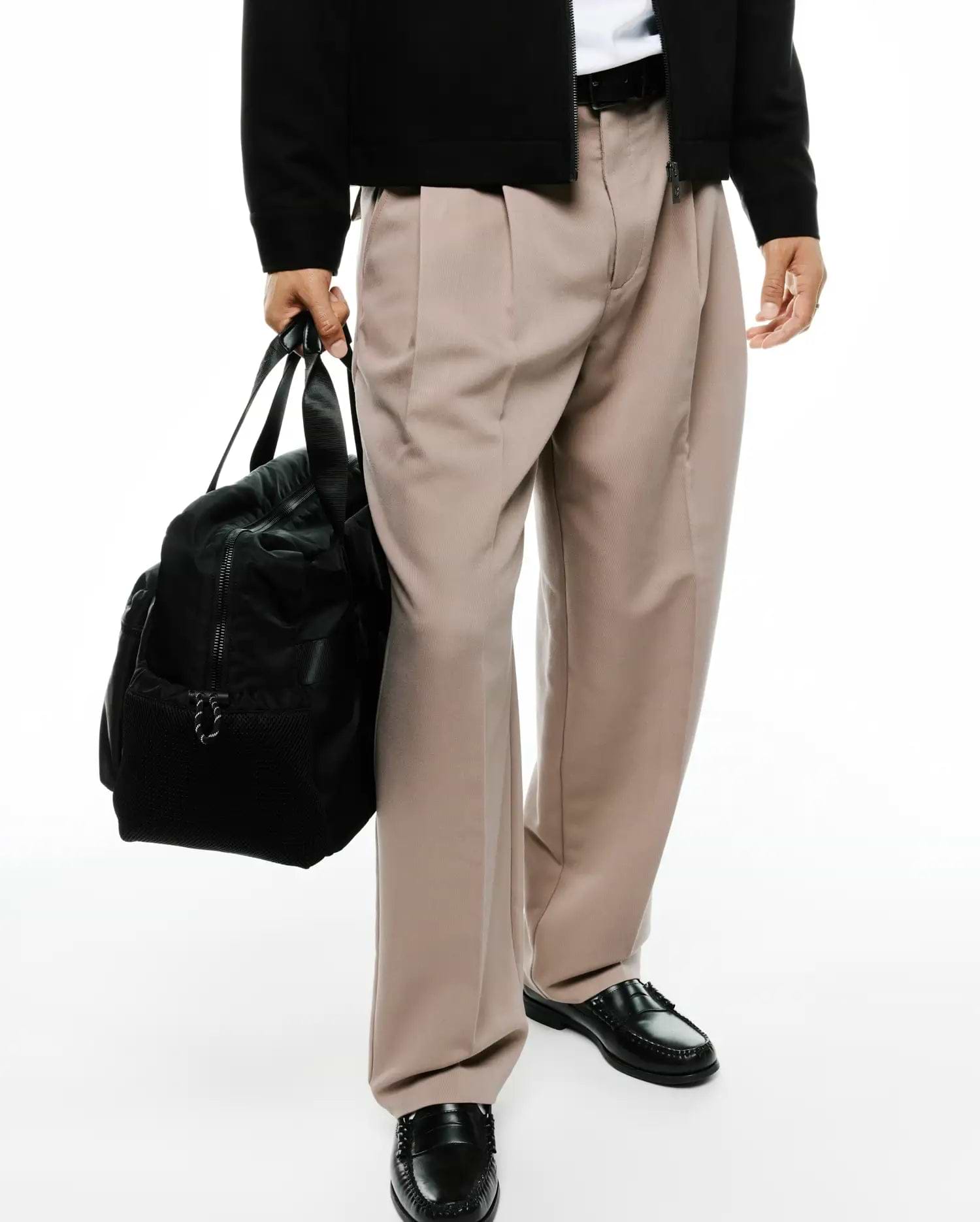 Men's Wayde Wide-Leg Pleated Pants in a smooth light beige fabric, featuring a relaxed wide-leg fit and prominent front pleats for a stylish streetwear look. (4)