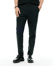 Mens Edward 10k Tapered Pant in dark green, featuring a slim tapered fit and smooth performance fabric, with a small embroidered Psycho Bunny skull logo on the upper right thigh.