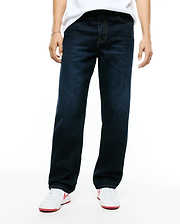 Men's Beck Oversized Denim Pants in dark indigo blue, featuring a relaxed straight leg fit, classic five-pocket styling, and contrasting orange stitching. (1)