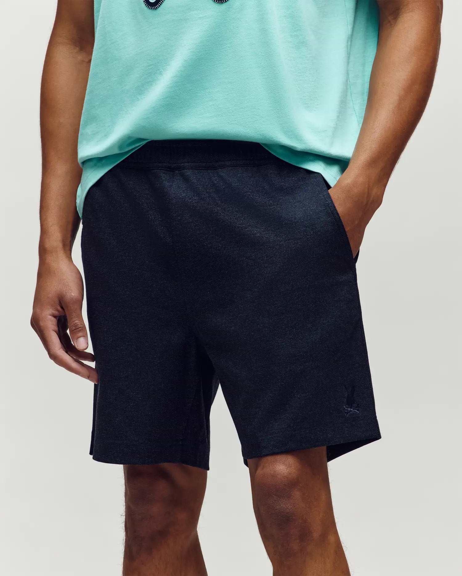 Mens Koda Oxford Short, dark navy heathered knit, relaxed fit shorts with an elastic waistband, side pockets, and a small embroidered Psycho Bunny skull logo on the left leg. (2)