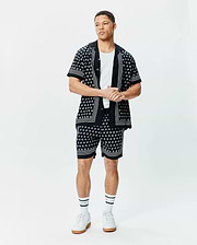 Black short-sleeve button-up shirt and matching Mens Nick Tencel Short 7, both featuring a white geometric pattern, white vertical placket stripes, and white horizontal sleeve/hem stripes, in a relaxed fit.