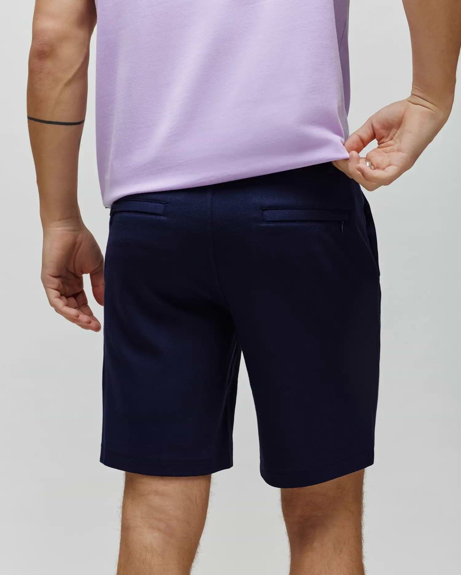 Mens Shiro Twill Short in deep navy, featuring a classic fit, visible twill fabric texture, and subtle Psycho Bunny text branding above the right back welt pocket.