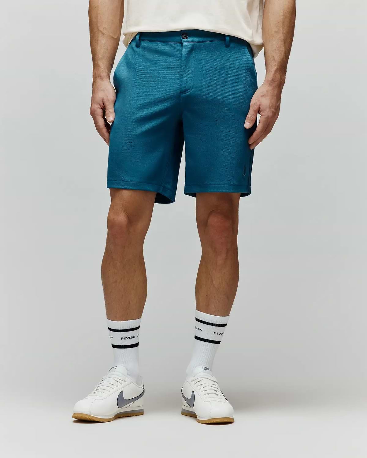 Mens Shiro Twill Short, a classic fit teal twill short with a subtle, tonal embroidered Psycho Bunny skull logo on the lower left leg. (1)
