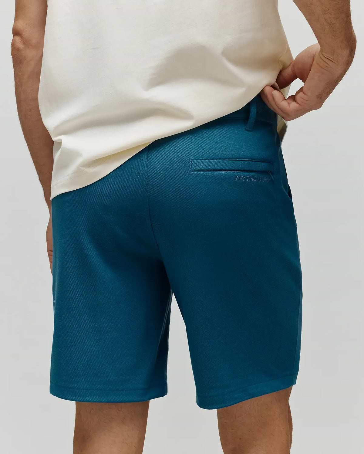 Mens Shiro Twill Short in deep teal, featuring a classic fit, fine twill fabric, and subtle tonal Psycho Bunny embroidery above the back right welt pocket. (3)