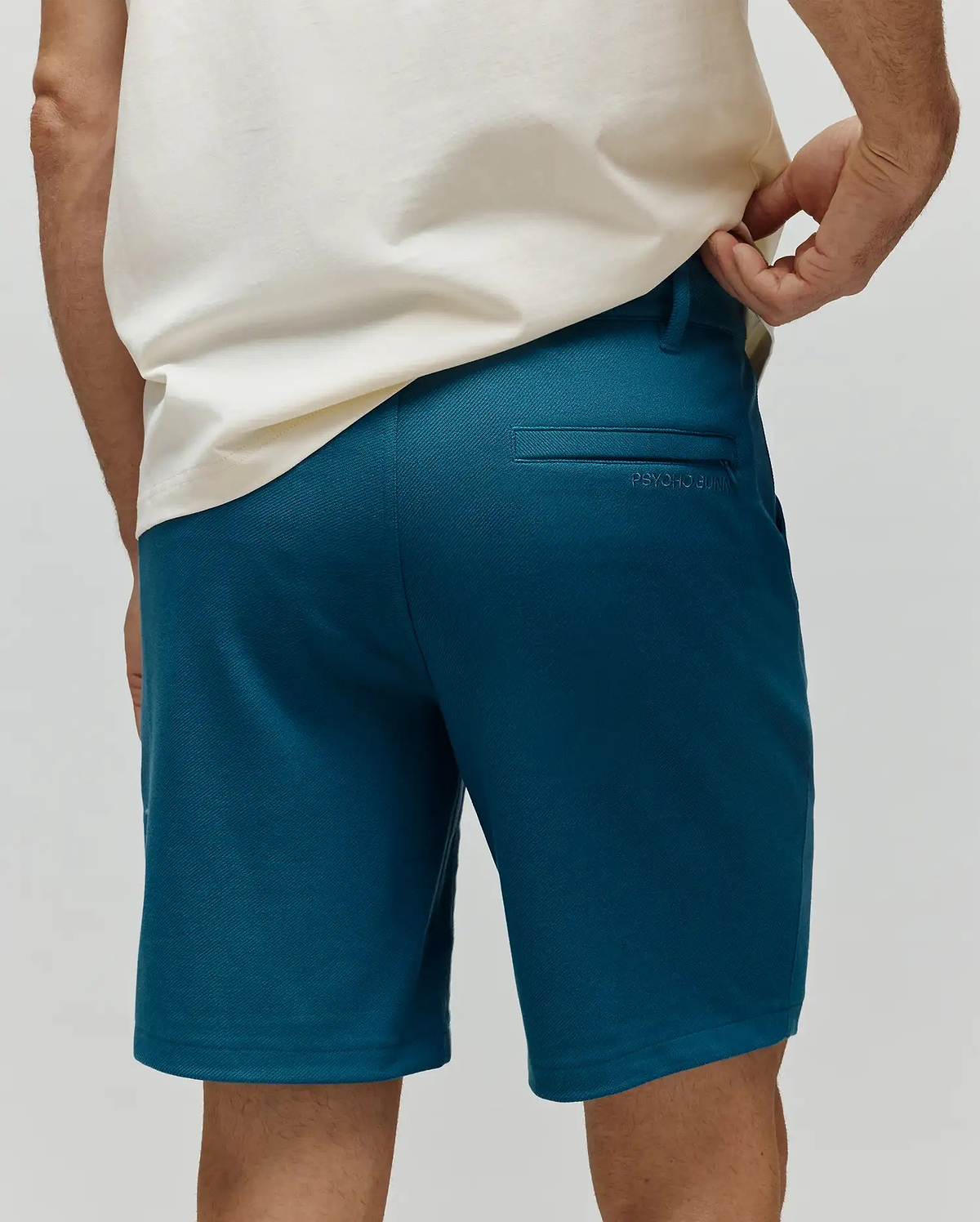 Mens Shiro Twill Short in deep teal, featuring a classic fit, fine twill fabric, and subtle tonal Psycho Bunny embroidery above the back right welt pocket. (3)