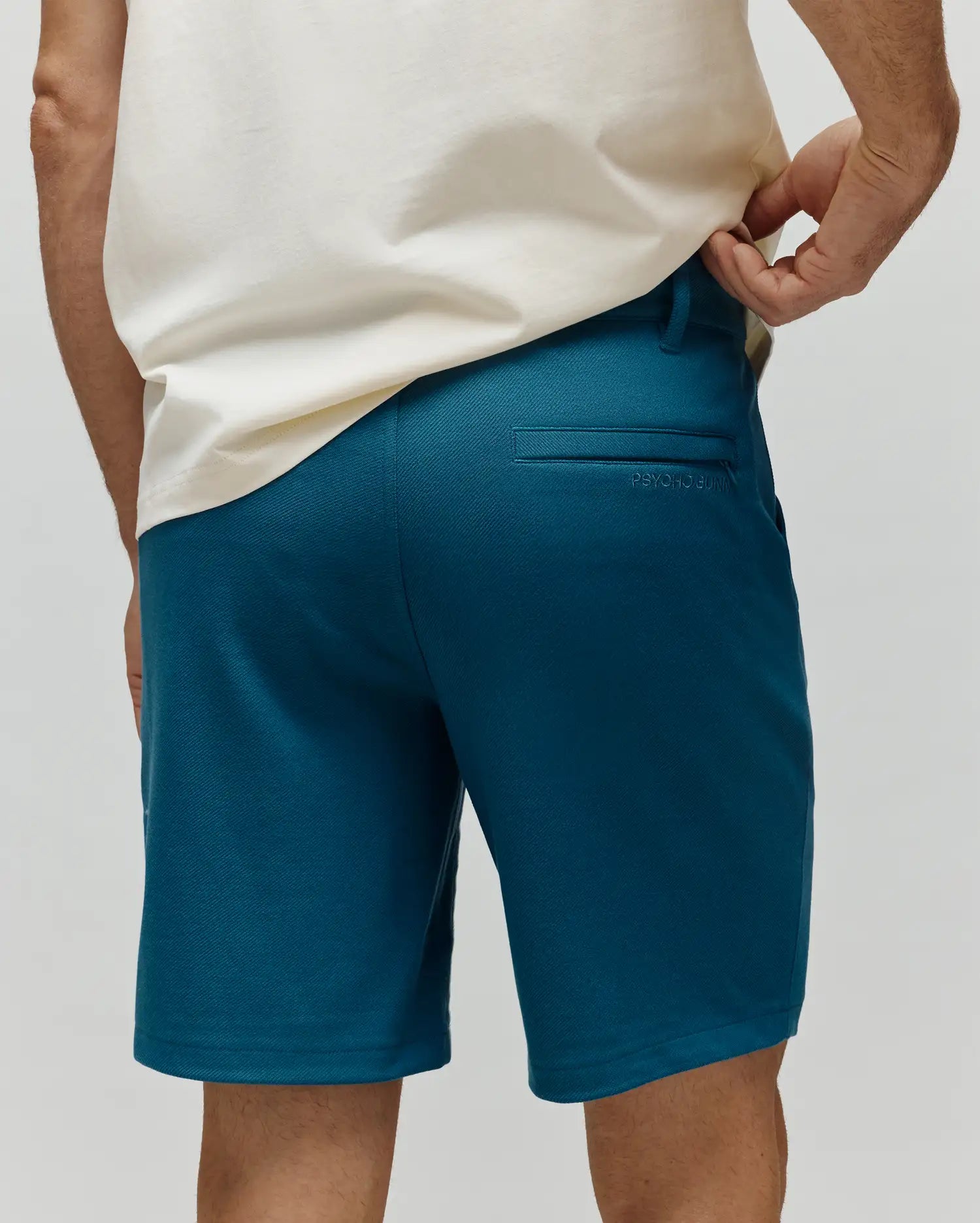 Mens Shiro Twill Short in deep teal, featuring a classic fit, fine twill fabric, and subtle tonal Psycho Bunny embroidery above the back right welt pocket. (3)