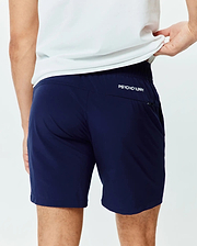 Mens Blaze Sport Short in navy, featuring a smooth performance fabric and a classic fit. A small white PSYCHO BUNNY text logo is on the upper back, with a zippered side pocket.