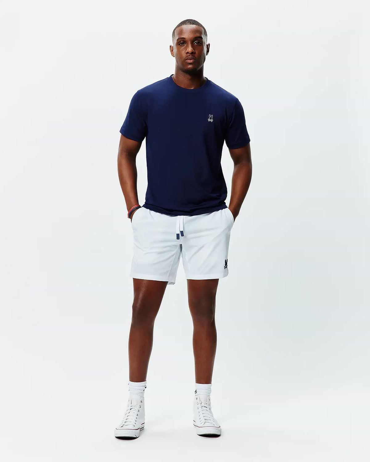 Navy jersey t-shirt with white embroidered Psycho Bunny skull on left chest, and white Mens Blaze Sport Short with navy-tipped drawstring and navy embroidered bunny skull on left leg.
