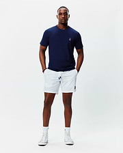 Navy jersey t-shirt with white embroidered Psycho Bunny skull on left chest, and white Mens Blaze Sport Short with navy-tipped drawstring and navy embroidered bunny skull on left leg.