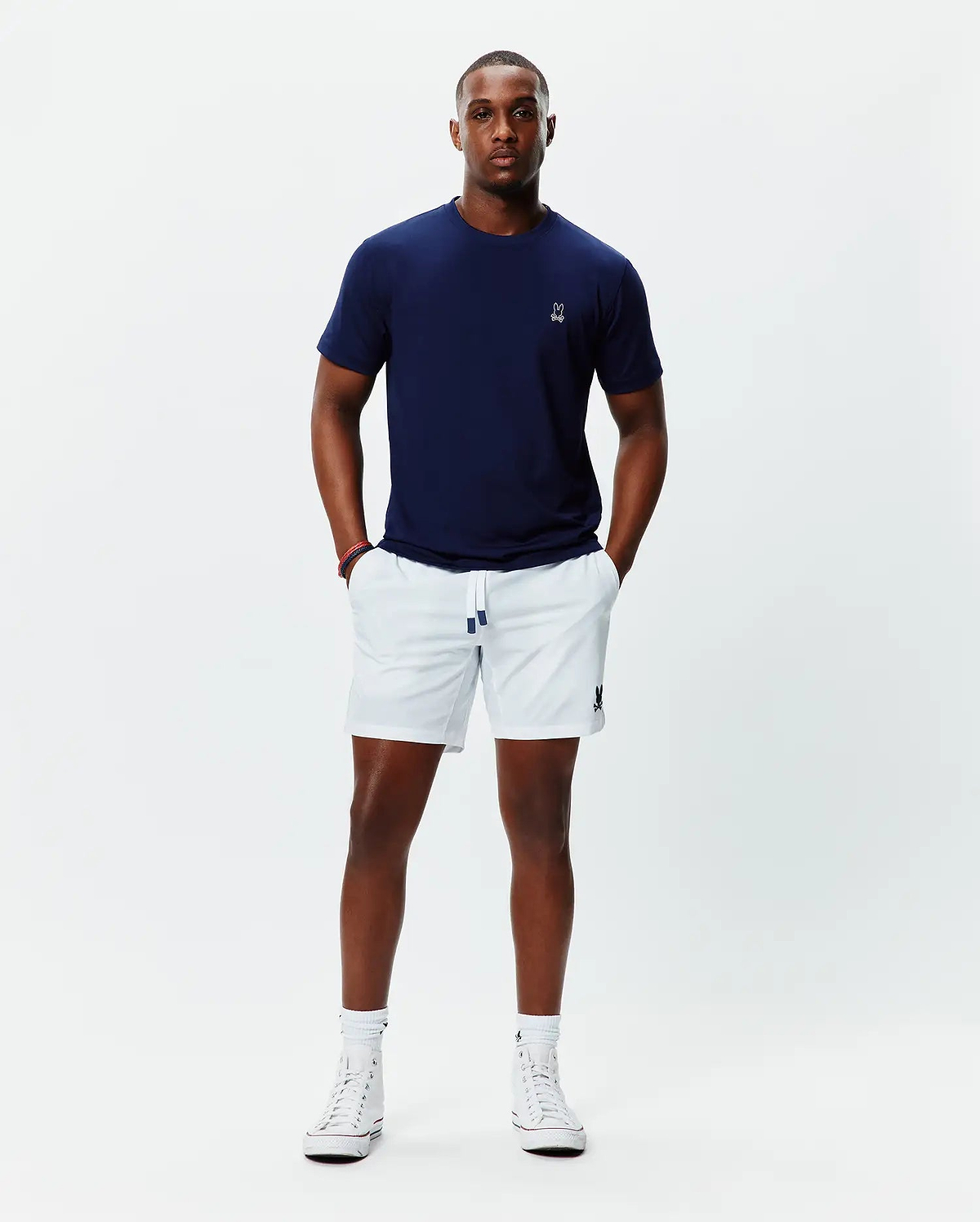 Navy jersey t-shirt with white embroidered Psycho Bunny skull on left chest, and white Mens Blaze Sport Short with navy-tipped drawstring and navy embroidered bunny skull on left leg.