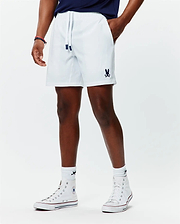 Mens Blaze Sport Short, white, relaxed fit, smooth performance fabric, featuring navy drawstring tips and a small embroidered navy Psycho Bunny skull logo on the lower left leg.