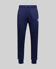 The Psycho Bunny MENS AUGUSTE JOGGER - MB0800015 in navy blue features 100% cotton, a drawstring waistband, side pockets, ribbed cuffs, and a small embroidered logo on the upper left thigh, shown on a light gray background.