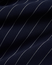 Mens Harland Double Weave Chalk Stripe Track Pant in deep navy blue, featuring fine, textured white chalk stripes woven into the fabric, highlighting its premium double weave texture. (6)