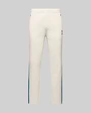 Mens Caspian Track Pant in cream smooth jersey, featuring a relaxed fit, teal side stripes, and a small embroidered Psycho Bunny skull logo on the upper right thigh. (5)