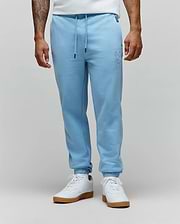 Mens Barry Joggers in light blue, featuring a relaxed fit and soft french terry fabric. Tonal embroidered Psycho Bunny skull logo on the left thigh, drawstring waist with black tips, and ribbed cuffs. (1)