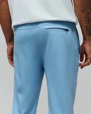 Mens Barry Joggers in light blue, crafted from soft french terry with a classic fit, featuring a ribbed waistband and a discreet zippered back pocket. (3)