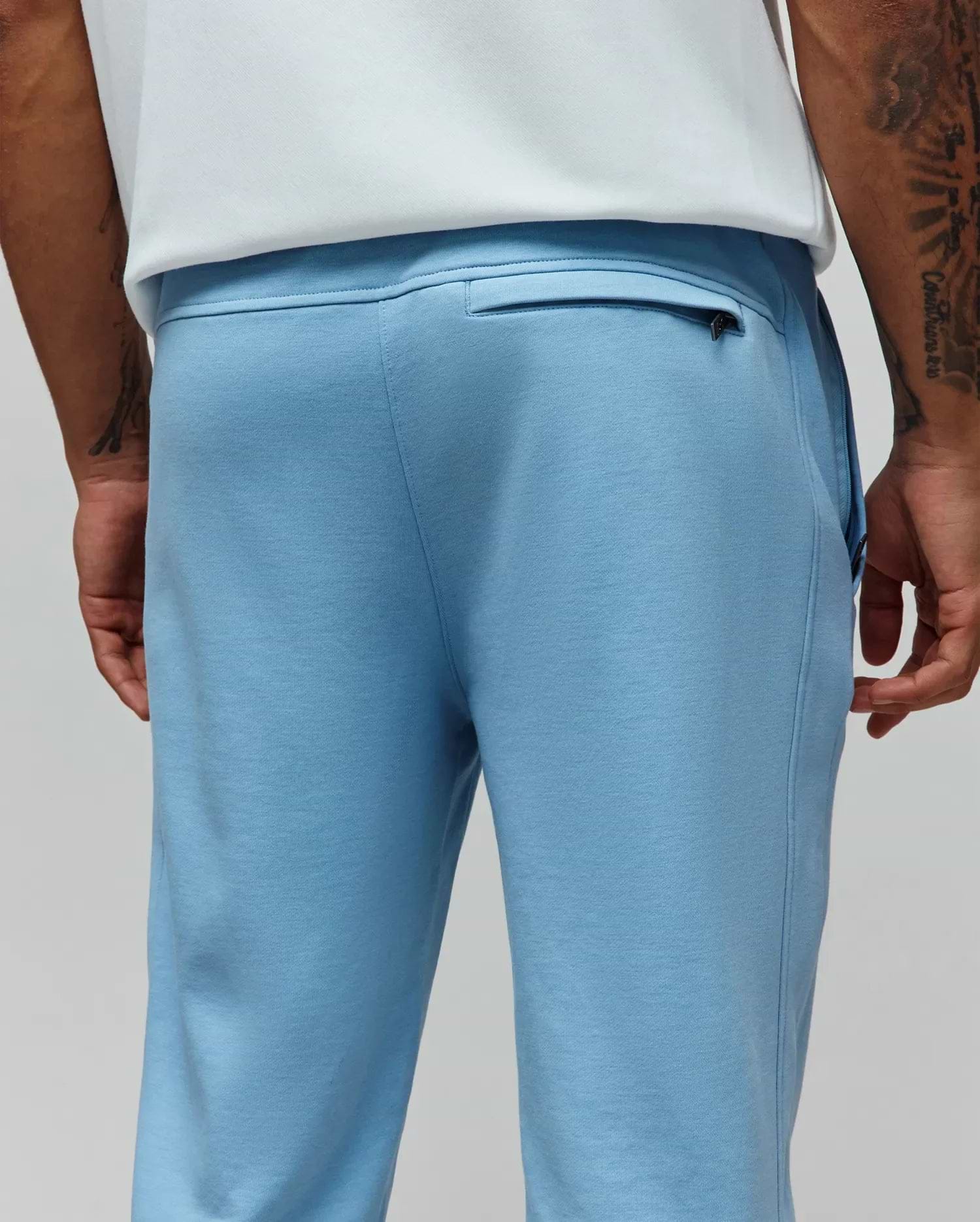 Mens Barry Joggers in light blue, crafted from soft french terry with a classic fit, featuring a ribbed waistband and a discreet zippered back pocket. (3)