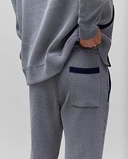 Mens Maxton Two Tone Jogger in a navy and white micro-pattern knit, with a relaxed fit, solid navy side piping, ribbed cuffs, and a back pocket with navy trim.