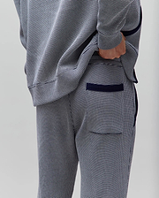 Mens Maxton Two Tone Jogger in a navy and white micro-pattern knit, with a relaxed fit, solid navy side piping, ribbed cuffs, and a back pocket with navy trim.