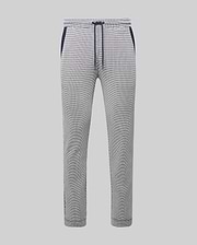 Mens Maxton Two Tone Jogger, a slim fit jogger in a white and black micro-patterned textured knit, featuring a navy blue drawstring, waistband, and side pocket trim.