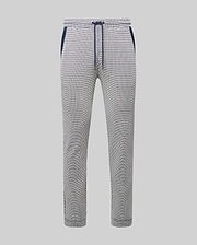 Mens Maxton Two Tone Jogger, a slim fit jogger in a white and black micro-patterned textured knit, featuring a navy blue drawstring, waistband, and side pocket trim.