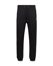 Mens Nathaniel Sweatpant, black relaxed fit french terry sweatpants featuring a drawstring waist, ribbed cuffs, and a small embroidered white Psycho Bunny skull logo on the left thigh. (5)