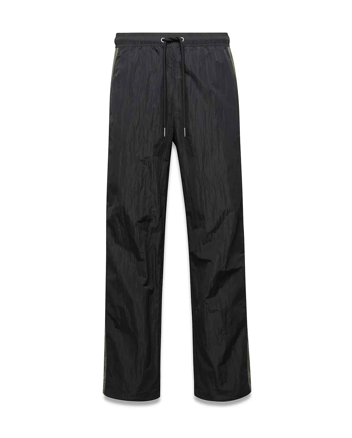 Mens Alder Nylon Colorblock Pant in black crinkled nylon, offering a relaxed fit with a drawstring waist and distinct olive green side stripes.