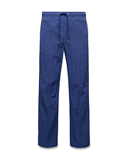 Mens Alder Nylon Pant in deep blue, featuring a relaxed straight leg fit, crinkled nylon fabric, and an elasticated drawstring waist with metallic tips. (5)