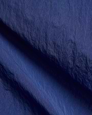 Mens Alder Nylon Pant in deep navy blue, featuring a crinkled nylon fabric with a subtle sheen, fine weave, and visible seam details. (6)
