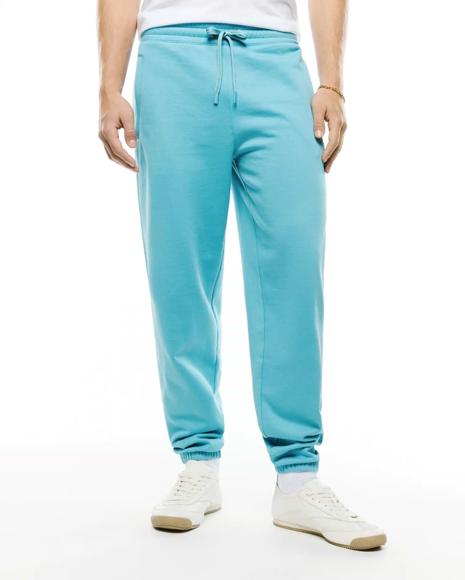 Mens Terrence Brushed Fleece Jogger in vibrant aqua blue, featuring a relaxed fit, brushed fleece fabric, drawstring waist, side pockets, and ribbed cuffs. No visible Psycho Bunny logo. (2)