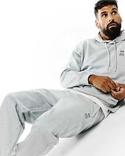 Grey relaxed fit brushed fleece hoodie with small embroidered Psycho Bunny skull logo on left chest, paired with matching Mens Terrence Brushed Fleece Sweatpant featuring the bunny skull logo on left thigh.