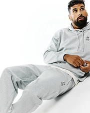 Grey relaxed fit brushed fleece hoodie with small embroidered Psycho Bunny skull logo on left chest, paired with matching Mens Terrence Brushed Fleece Sweatpant featuring the bunny skull logo on left thigh.