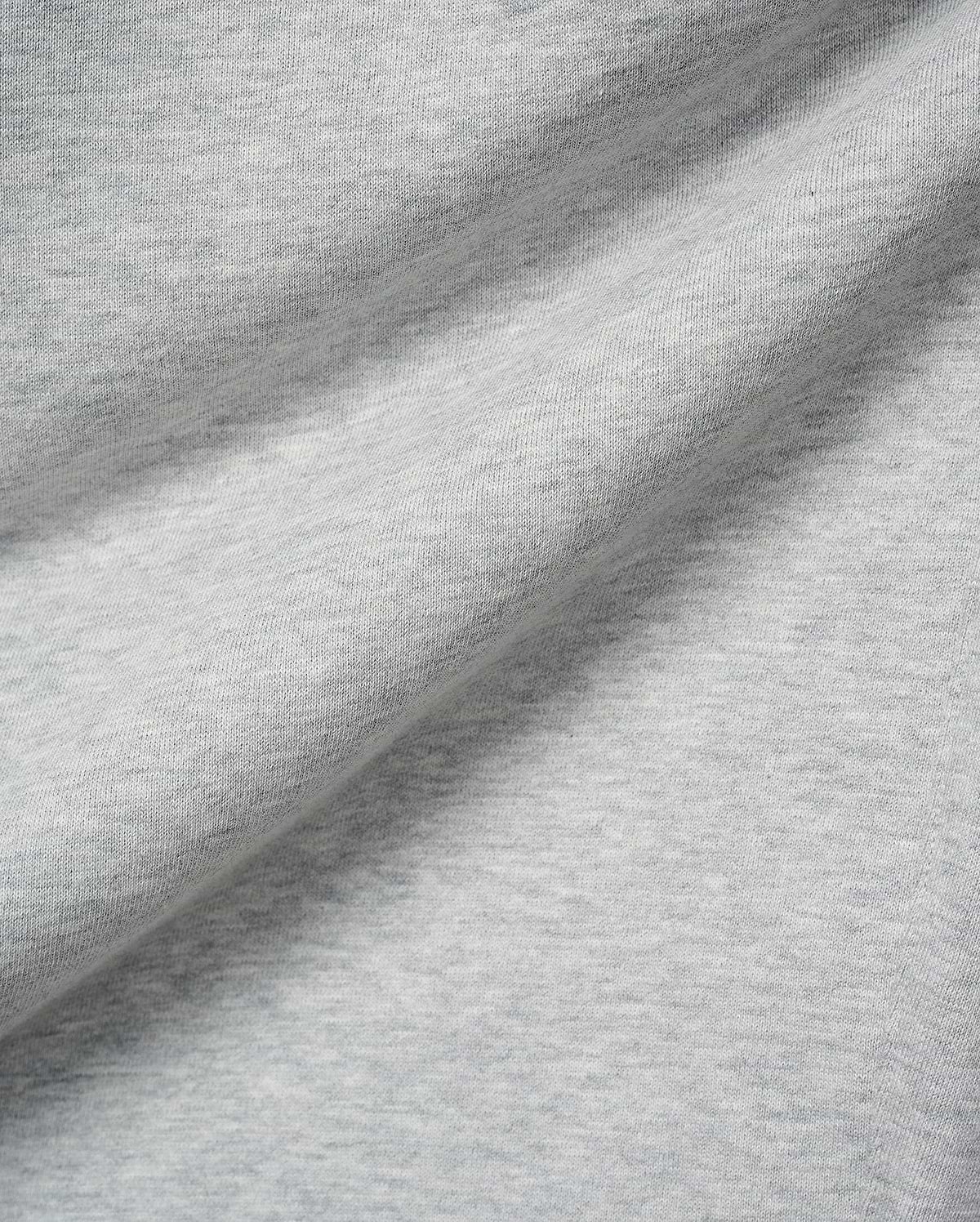Mens Terrence Brushed Fleece Sweatpant, featuring a soft, light grey heathered brushed fleece fabric with a subtle knit texture and gentle folds.