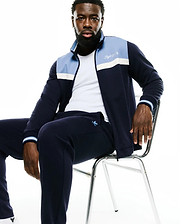 Navy Psycho Bunny full-zip track jacket with light blue and white chest stripes, embroidered script logo, and matching Men's Jacques Pique Track Pants with a small bunny skull. (4)