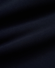 Rich, deep navy blue Pique fabric for the premium MEN'S JACQUES PIQUE TRACK PANTS, featuring a distinct, textured weave indicative of refined streetwear quality. (6)