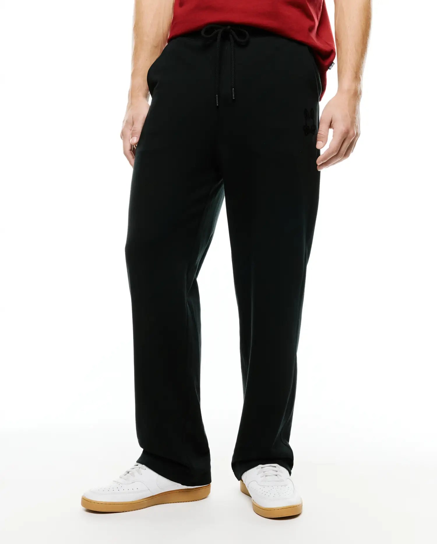 Men's Johan Straight-Leg Sweatpants, black, with a relaxed straight-leg fit, soft jersey fabric, and a small tonal embroidered Psycho Bunny skull logo on the upper left thigh, plus a drawstring waist. (2)