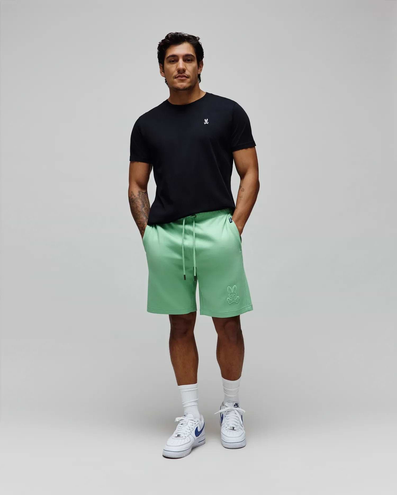 Black jersey tee with small white bunny skull embroidery on left chest, and Mens Barry Short mint green relaxed french terry shorts with large tonal bunny skull embroidery on left thigh. (5)