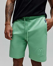 Mens Barry Short in mint green, a relaxed fit French terry short with drawstring waist, featuring a large embroidered Psycho Bunny skull logo on the left leg and a navy woven label on the right pocket. (2)