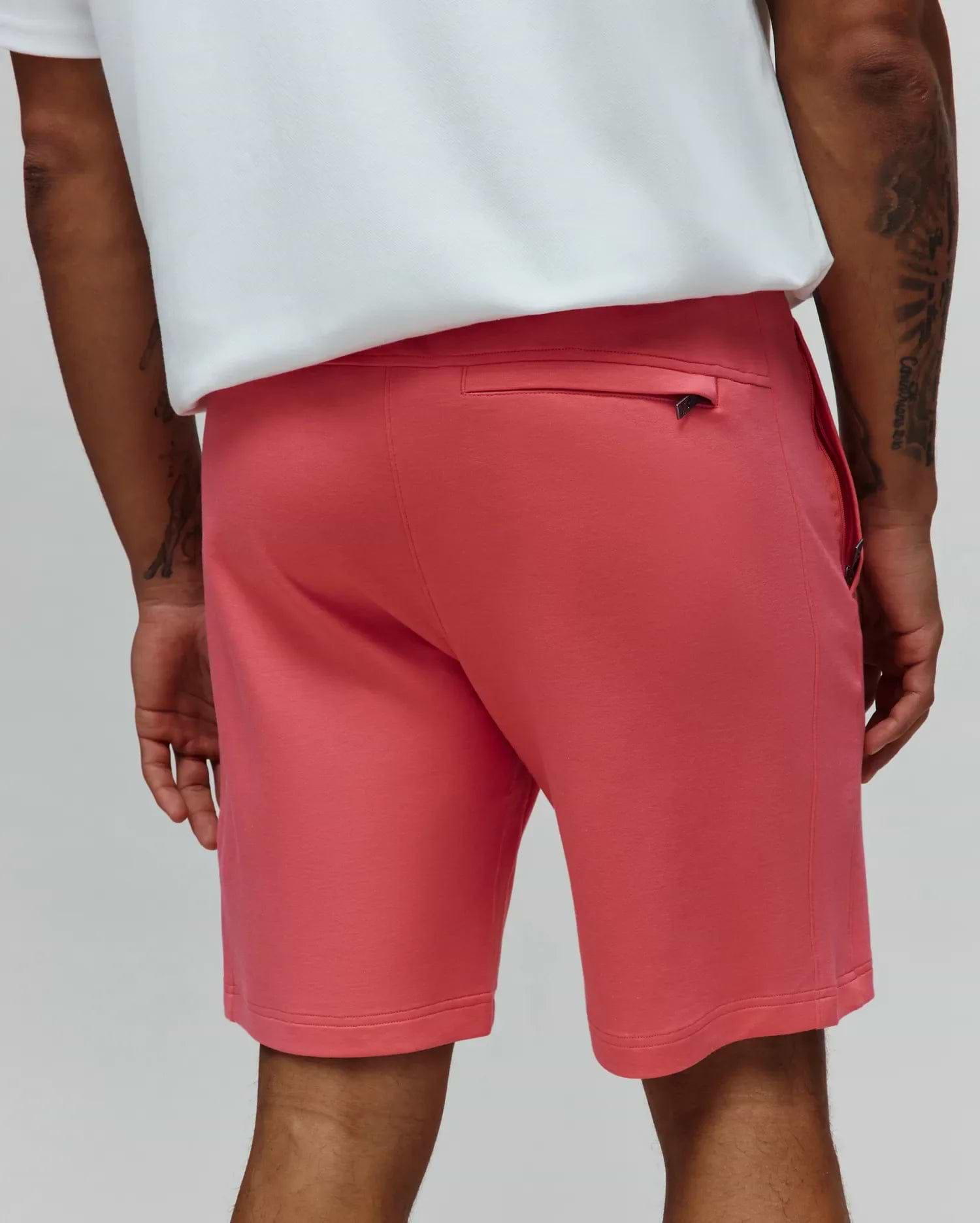 Mens Barry Short, a vibrant coral relaxed fit jersey knit short with a subtle Psycho Bunny skull logo on the sleek black zippered back pocket pull. (3)