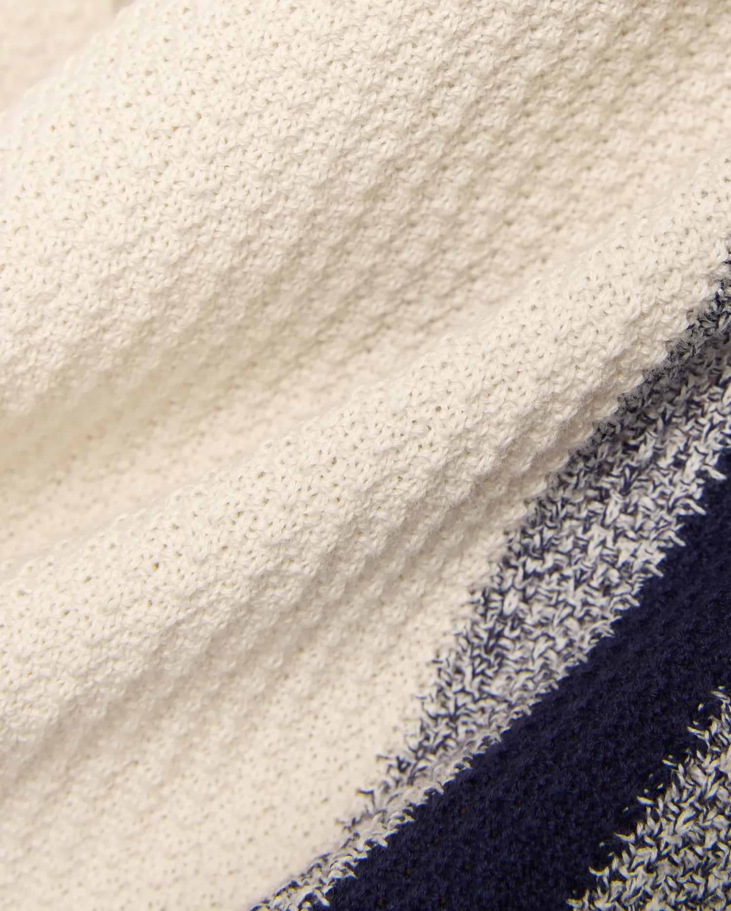 Mens Giles Knit Short 7, a premium cream textured knit short with prominent navy and marled blue stripes, embodying Psycho Bunny's bold, refined streetwear style.
