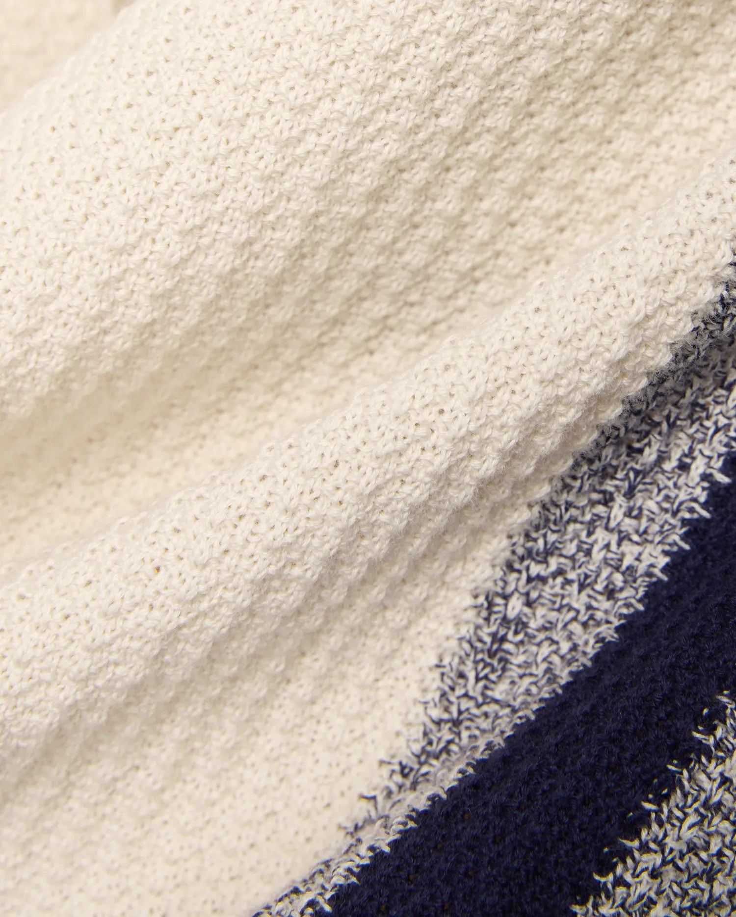 Mens Giles Knit Short 7, a premium cream textured knit short with prominent navy and marled blue stripes, embodying Psycho Bunny's bold, refined streetwear style.
