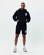 Black relaxed fit French terry hoodie with a large colorful abstract bunny skull graphic on the left chest, paired with matching Mens Isaac Print Short with the same graphic on the left thigh.