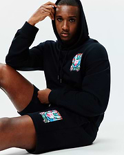 Black relaxed fit hoodie and Mens Isaac Print Short, both in soft jersey, featuring a vibrant multi-color Psycho Bunny skull logo on the left chest and left thigh.